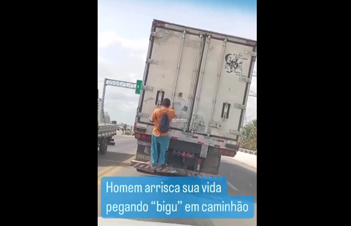 Homem se pendura em caminhão na ponte Presidente Dutra